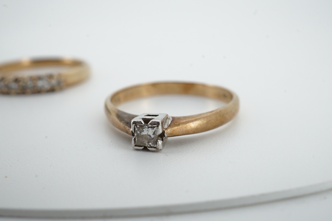 A 9ct gold and solitaire diamond set ring, size O/P and a 9ct gold an seven stone diamond set half hoop ring, size O, gross weight 4 grams.